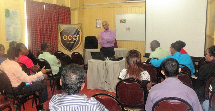 Presindent of the GCCI, Vishnu Doerga, Presents to participants of the Awareness Session