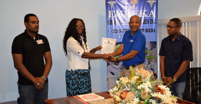 from left Shawn Manbodh, Rodlyn Semple, Andrew Boyle, and Ren Gonzales - presentaion of renewal certificate