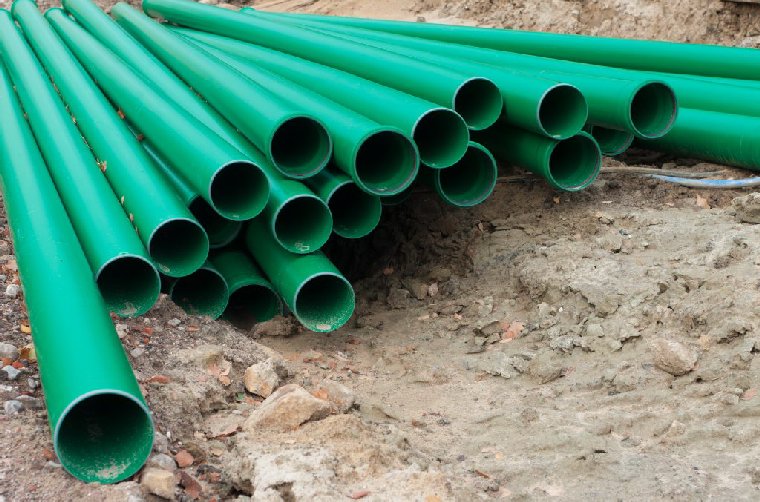 green pvc pipes on a construction site