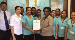 From left: Medical Director Dr. ChetramBudhu, General Manager Mrs. Ratna Budhu, Laboratory Manager Mrs. Kulwantie Mohabir, GNBS Mrs. Candelle Walcott-Bostwick and staff of Quest Medical Centre.